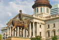 A view of the SC State House and one of the statues on the grounds